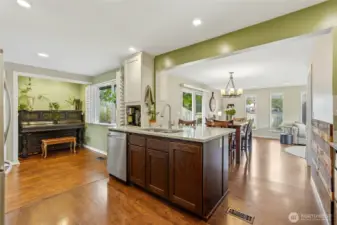 Kitchen flows directly into the dining nook and dining room.