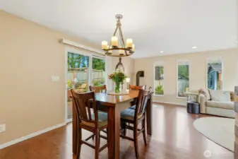 Dining room features a glass sliding door that opens to the deck and backyard.