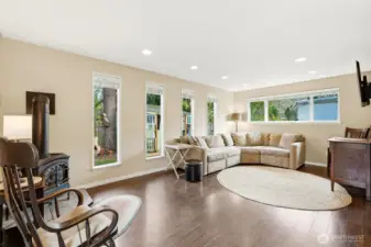 Oversized family room with windows on three different walls.