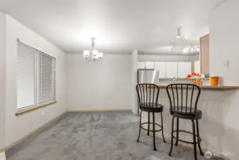 Dining Area off Kitchen with Breakfast Bar & View of Private Covered Entry Patio