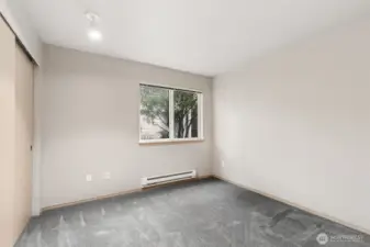 Bedroom 2/Office Space with Closet & Landscape View between Buildings