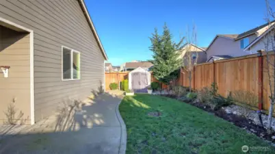 Beautiful back yard with large shed that stays.