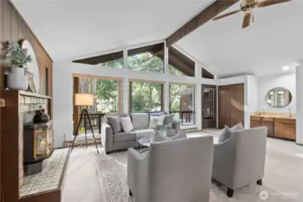 Comfortable living space centered around a cozy fireplace.