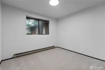 Additional bedroom ideal for guests, office, or flex space.