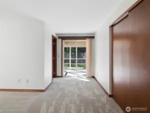 PRIMARY BR - Sliding Glass Doors to Screened Porch/Deck. Closet on right.