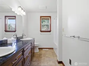 BATHROOM #2 - Granite Counter w two Sinks. New Tub/Shower on right.