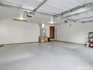 2 CAR GARAGE - Epoxy Flooring, new Paint. Door to Family Rm.