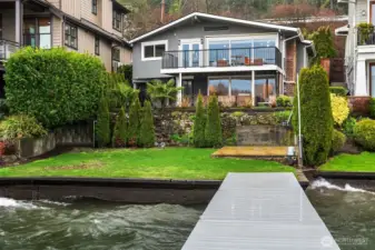 Charmingly updated bungalow with 32 feet of waterfront.