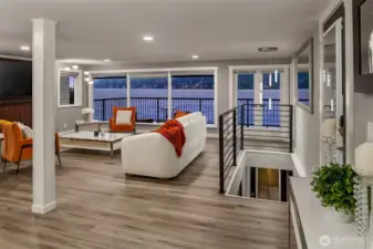 Main level features the open kitchen and living spaces, one bedroom, 3/4 bathroom and office/den.