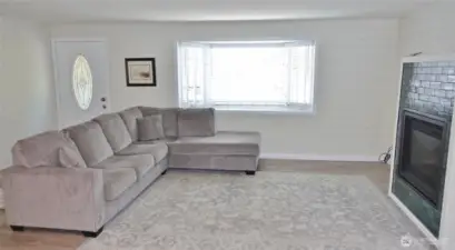 Enter into this nicely re-done home w/ LVP flooring and Propane Fireplace.