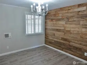 1st Guest Bedroom w/ a unique reclaimed wood wall.