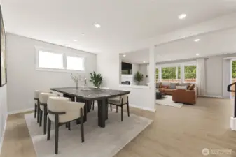 Formal dining adjacent to the great room, virtually staged.