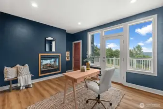 This bonus room can be used as a study, den or office and provides lots of natural light, privacy and storage. The perfect work from home set up!