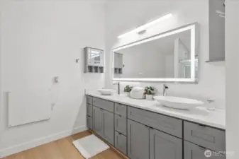 Updated vanity with grey shaker cabinets and drawers. Plenty of storage! Lux Hardwired LED Mirror with Color Changing Temperature, convection wall heater, luxury vinyl plank flooring, craftsman trim.