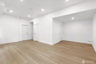Fully renovated finished basement. Walk out the glass sliding door to a backyard patio. Rockwool insulation on the ceiling for noise reduction. Plumbed for a wet bar. Luxury vinyl plank flooring, fresh paint, solid wood, single-panel white shaker doors with full wood craftsman bungalow casing craftsman trim, and adjustable canless lighting throughout the home.