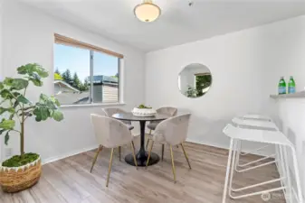 From the living room, glide over to the dining room with updated engineered hardwood flooring. This space is exquisitely illuminated with so much natural light from the dual walls of large windows.
