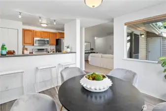 Beautiful natural light bathes the entire dining and kitchen space, providing the perfect illuminated setting to enjoy delectable meals.