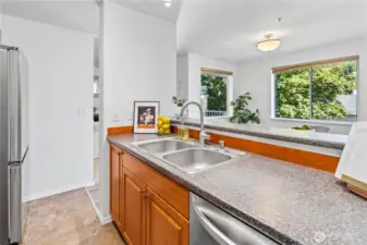 So much beautiful natural light envelopes the kitchen and dining space. Hosting a dinner party? Clear sight lines from the kitchen to the dining room allow for easy entertaining and meal serving from cooktop to dinner table.