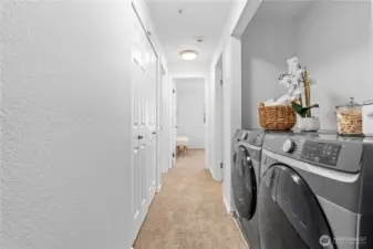 Utility closet with your full-sized Washer/Dryer set that stays.