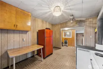 The kitchen connects seamlessly to an adjacent nook space.