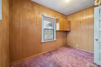 One of two designated bedrooms on the main level.