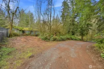 This road and property end at the fence on the North of the property