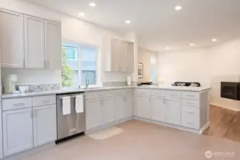 High end white woodwork and sparkling appliances.