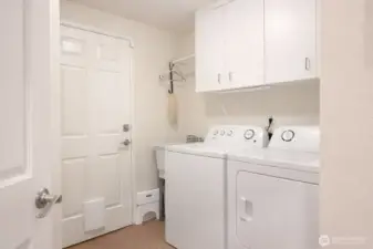 A convenient place for the washer and dryer, the door to the left leads into the 2 1/2 car garage.