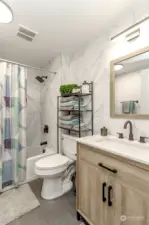 Well-dressed full bath serves your guests and bedrooms two and three.