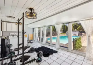 Amazing Sunroom with views of the Sparkling Pool w/Tile Floors, Convenient Laundry Area and Access to Full Bath and Pool. Use as Home Gym, Yoga or Meditation Room or Poolside Cabana. So Many Options!