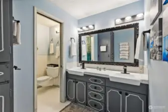 Main Bath w/Double Vanity, Oversized Mirror, New Light Fixtures and Linen. Shower and Toilet are able to be closed off, making this super useful for multiple people to use the different spaces at the same time!