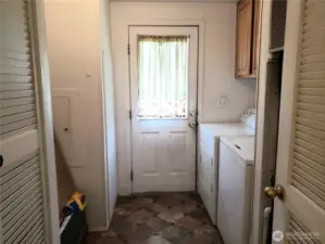 Huge walk Through Utility Room with Storage Cabinets.