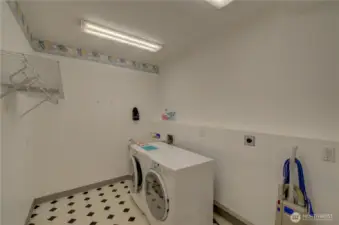 Main floor laundry off the kitchen and garage