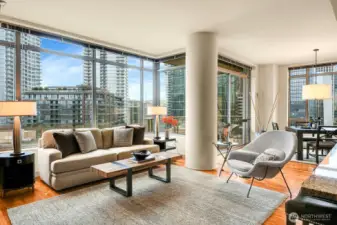 Enjoy sweeping views from walls of windows in this premier corner unit.
