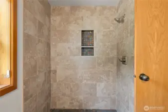 New tiled shower in primary bath.