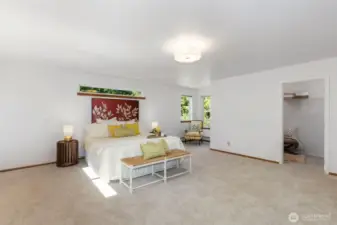 Main level primary with not one but two walk in closets and a private bath with jetted tub, shower, and double sinks.