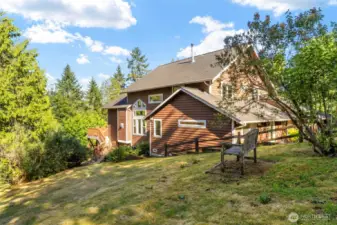 Close to amenities, yet surrounded by enough property and stately evergreens to create privacy.