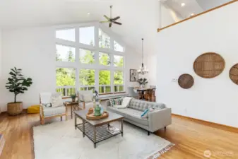 Soaring vaulted ceilings, and walls of windows showcase the surrounding natural beauty.