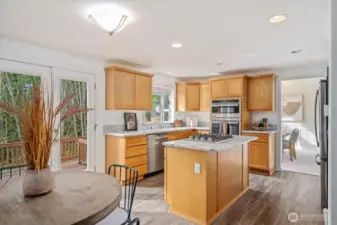 Continuous Luxury vinyl from kitchen through Family Room