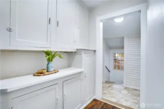 Preserved and refreshed, these original cabinets blend timeless craftsmanship with modern appeal and so close to the kitchen, they can add a dedicated pantry space, a linen closet, and bonus storage for this home.