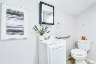 Tucked at the back of the home for added privacy and convenience, this half bath is perfect for guests and everyday ease.