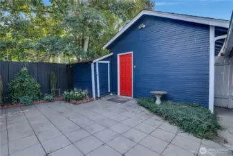 Extra storage abounds with a detached one-car garage and two additional sheds—perfect for tools, gear, seasonal items, or hobby space.