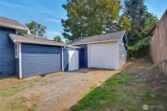 A large one-car garage and expansive driveway offer plenty of room for an RV, trailers, boats, or multiple vehicles—perfect for flexible parking and storage needs.