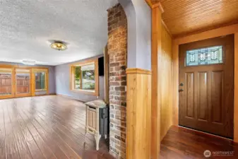 Entryway with gracious wood paneling.
