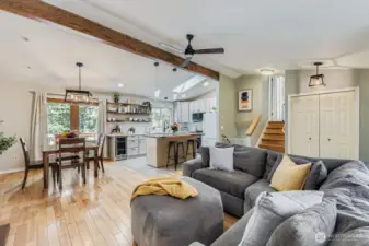 Stylish open floorplan with updated kitchen, hardwoods, and deck off of dining area