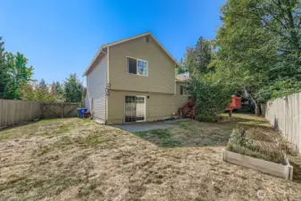 Big fenced yard that backs up to private greenbelt with fruit trees, outdoor garden shed