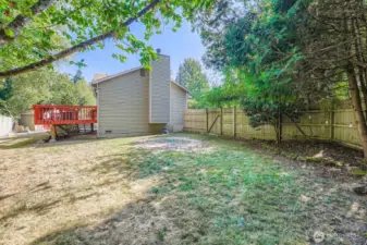 Big fenced yard that backs up to private greenbelt with fruit trees, outdoor garden shed