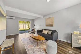 Spacious family room with slider access to backyard and patio.