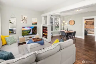 Unit #2015: view from the entryway - note the original built-ins and columns, and space to flex between living and dining areas.