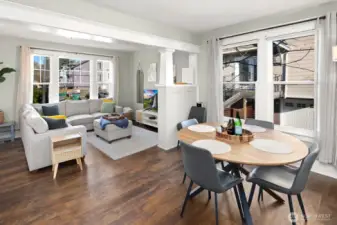 Unit #2015: Dining area flowing seamlessly back toward the living room.